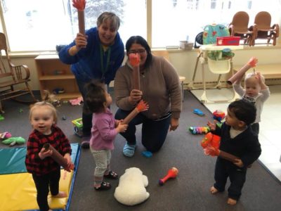 Teachers and Young infant students enjoying playtime
